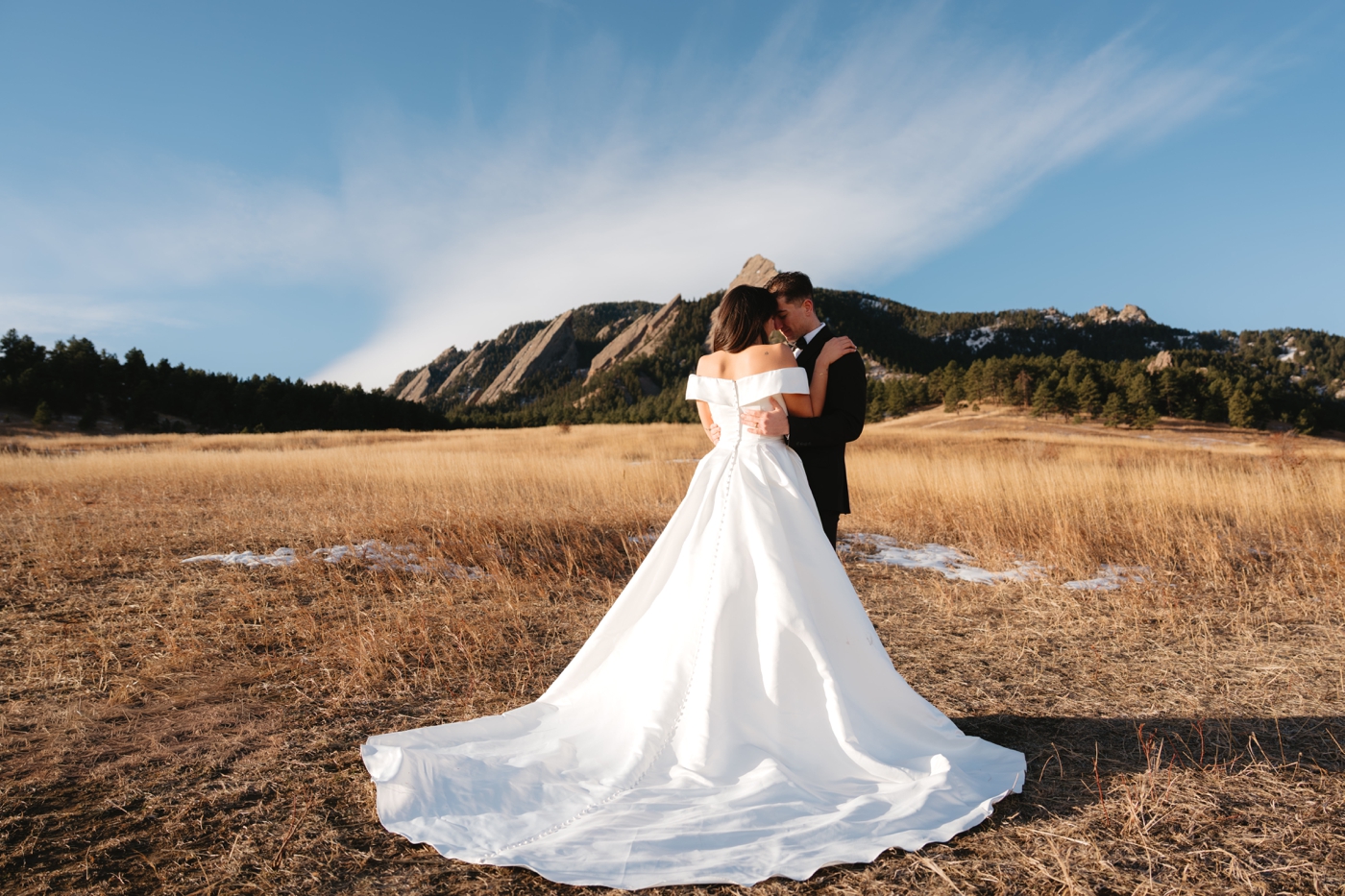 Bride and groom in front of the Boulder Flatirons