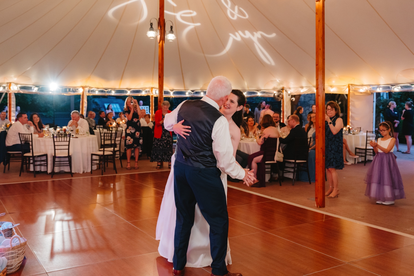 Father-daughter dance under tent