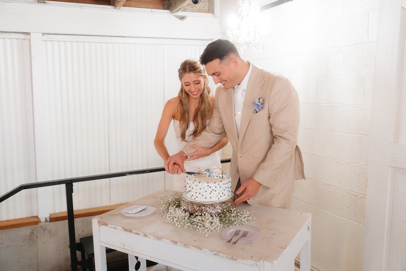 Cake cutting at wedding reception at rustic Colorado wedding